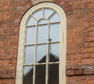 Curved headed picture window by Merrin Joinery